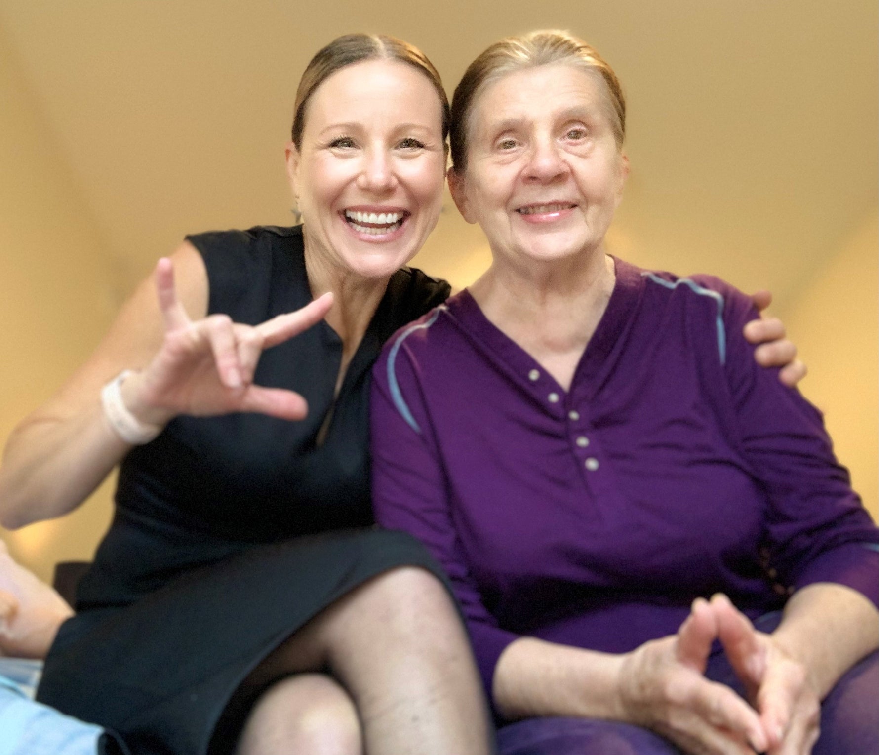 MJ  and her mother sitting together 