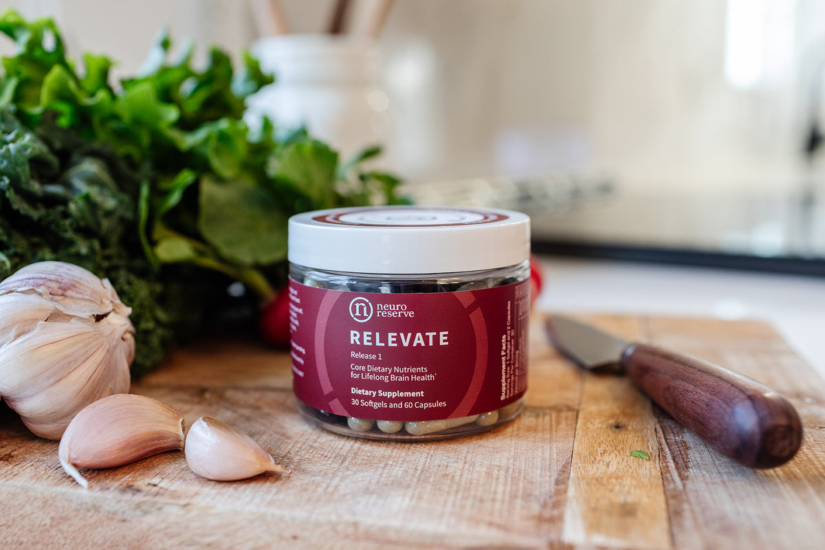 Close-up photo of RELEVATE Brain Health Supplement on cutting board 